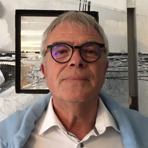 Profile view of a man with red hair and beard