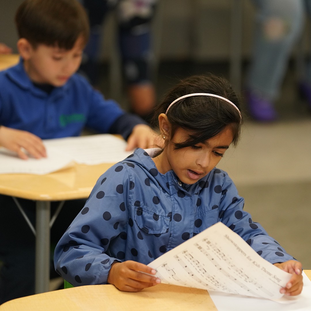 Student receiving in-class academic support from a HOKALI in-school educator.