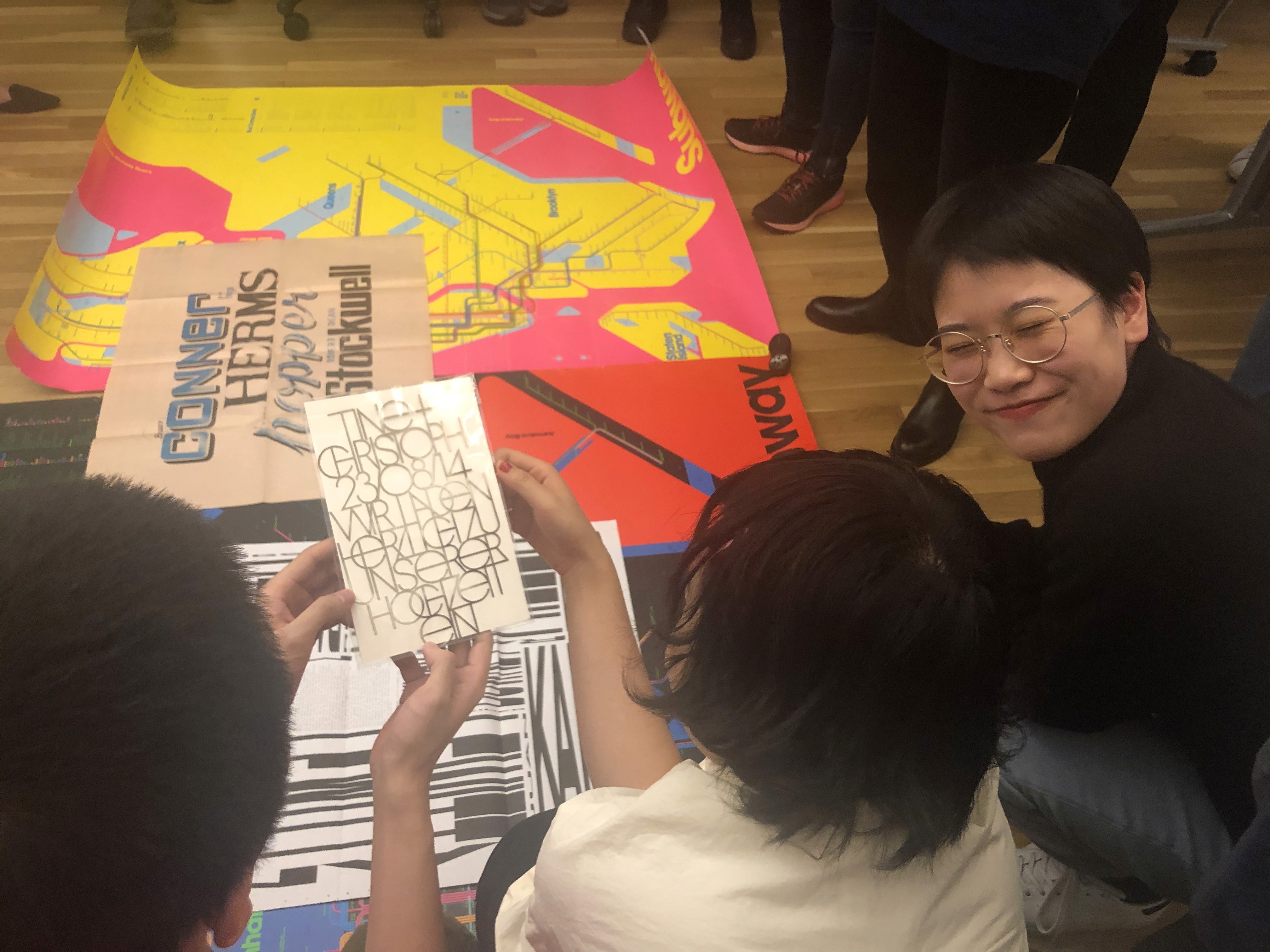 Finely Crafted and Resonant guest lecture students looking at posters