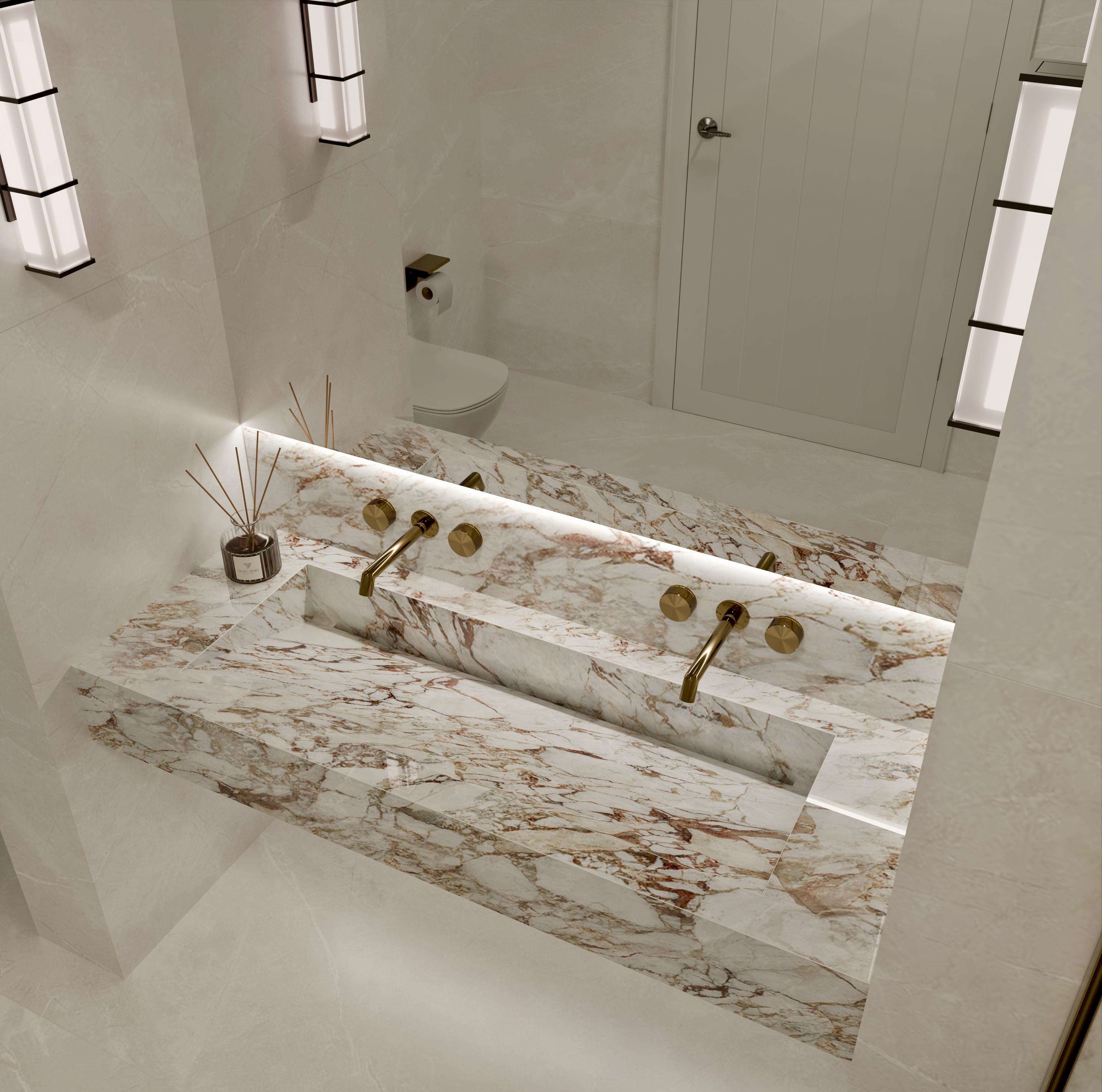 Modern building with glass walls, illuminated trees, and people overlooking a cityscape at sunset