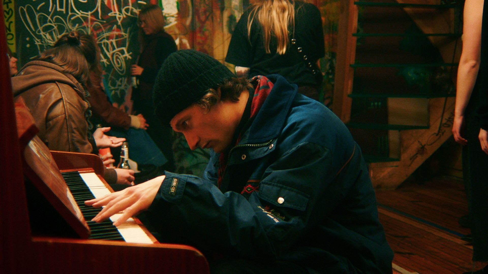 Actor Joonas Koff, who plays Sebastian in “Pikad Paberid” (“Rolling Papers”, 2024), playing piano on set.