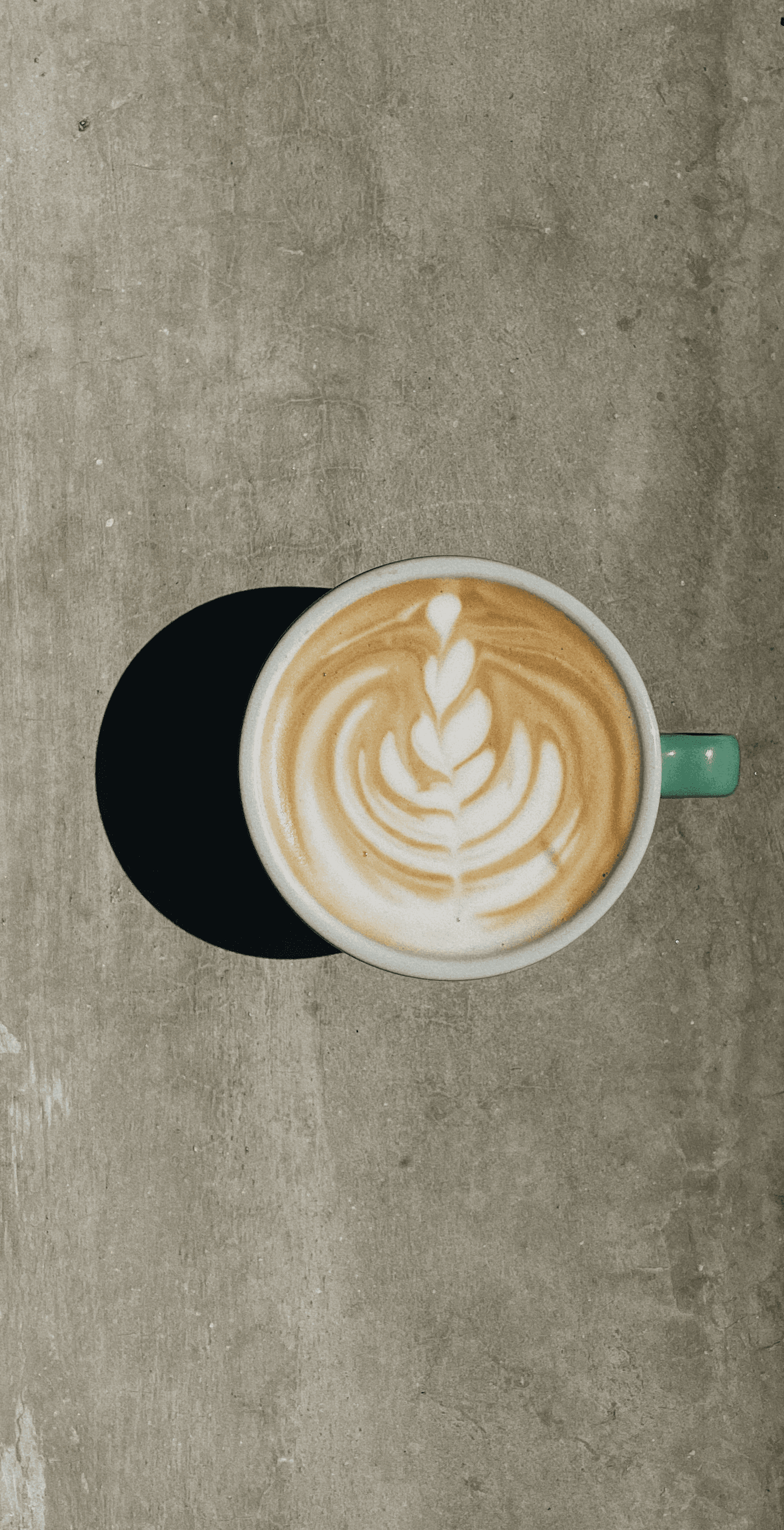 Minimalist design of two stacked boxes, one in sleek gray and the other in vibrant yellow, with branding initials 'SP,' illuminated by soft natural light.