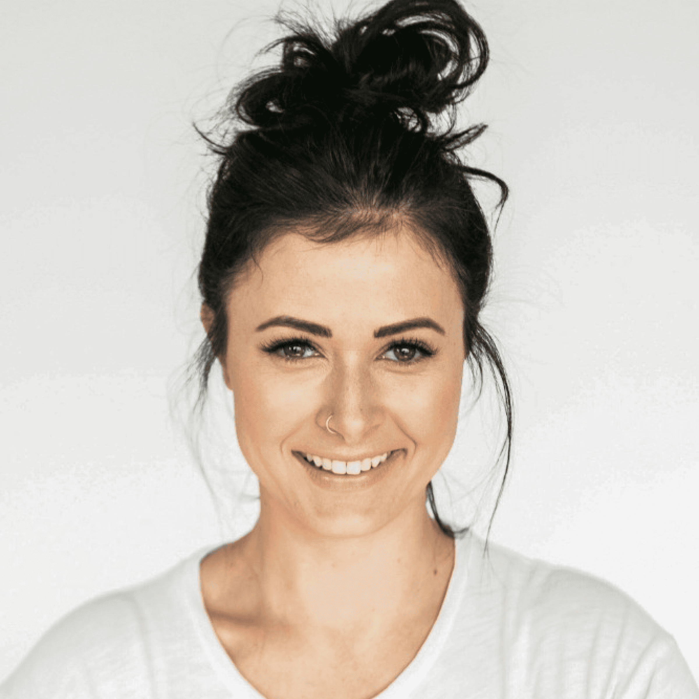 Women looking straight into the camera while choosing products in the supermarket