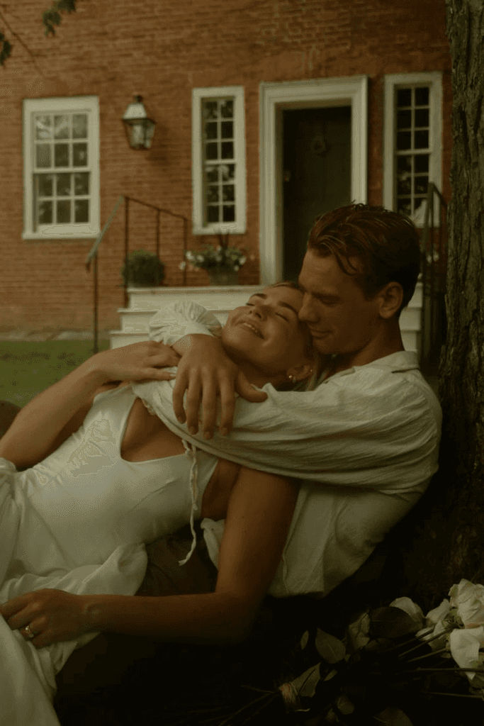 A serene spa setting with two lounge chairs beside a warm, reflective pool and soft, natural lighting.