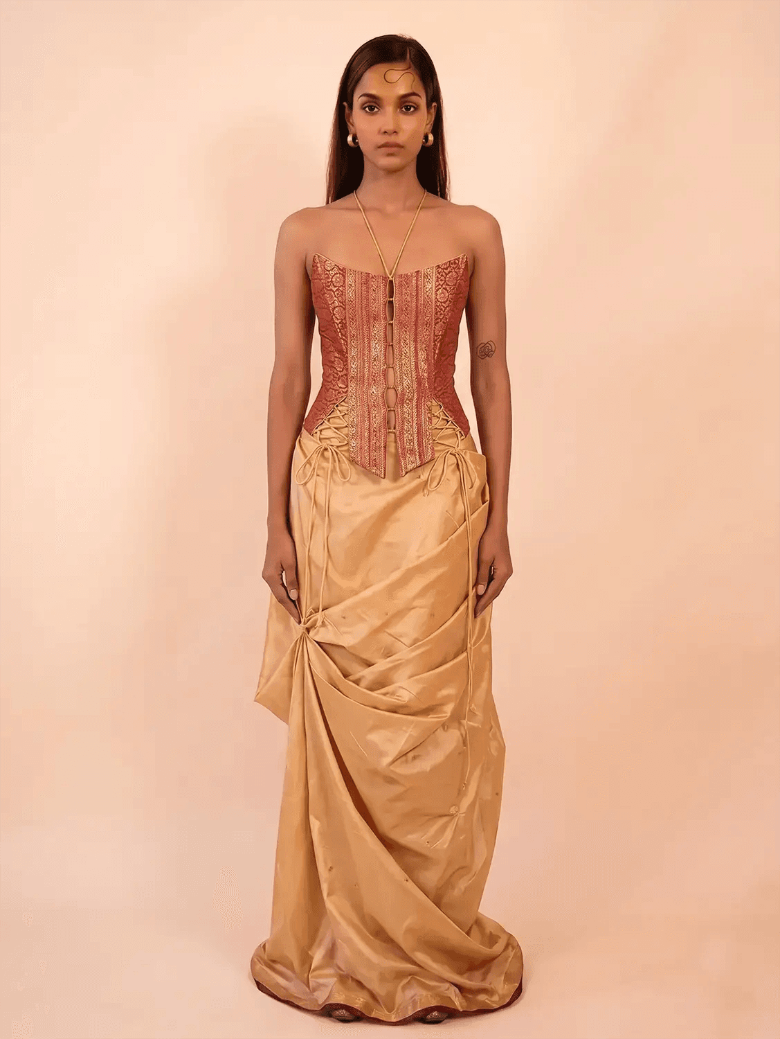 Raina is our one-of-a-kind four-panel corset, handcrafted in-house using a vintage silk saree.