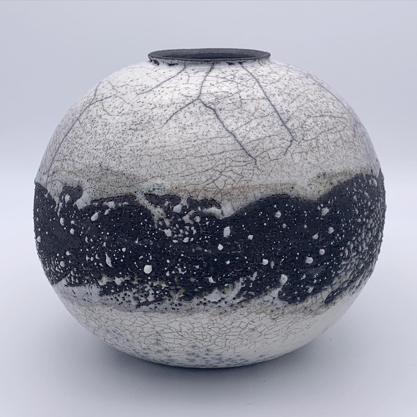 Black and white crackle raku ceramic vessel