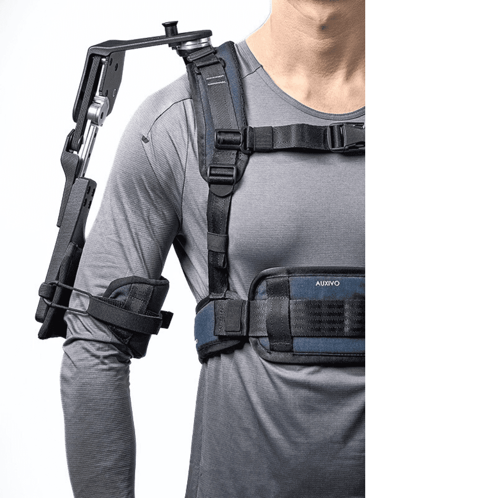 Close view of a person wearing the DeltaSuit exoskeleton, designed to support the shoulders and arms during repetitive tasks at height.