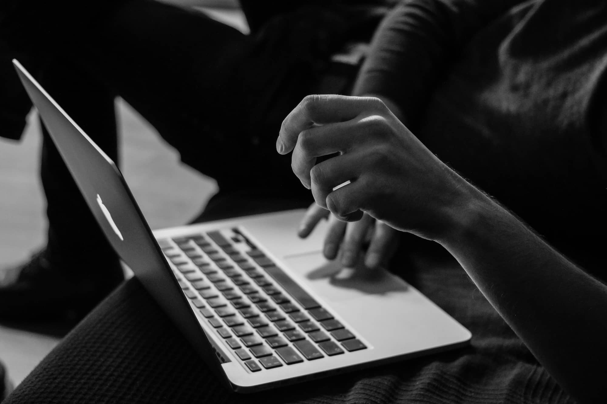 man working on a macbook