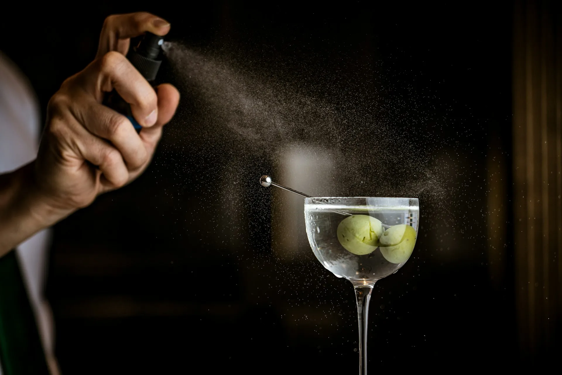 Martini being misted with saline tincture