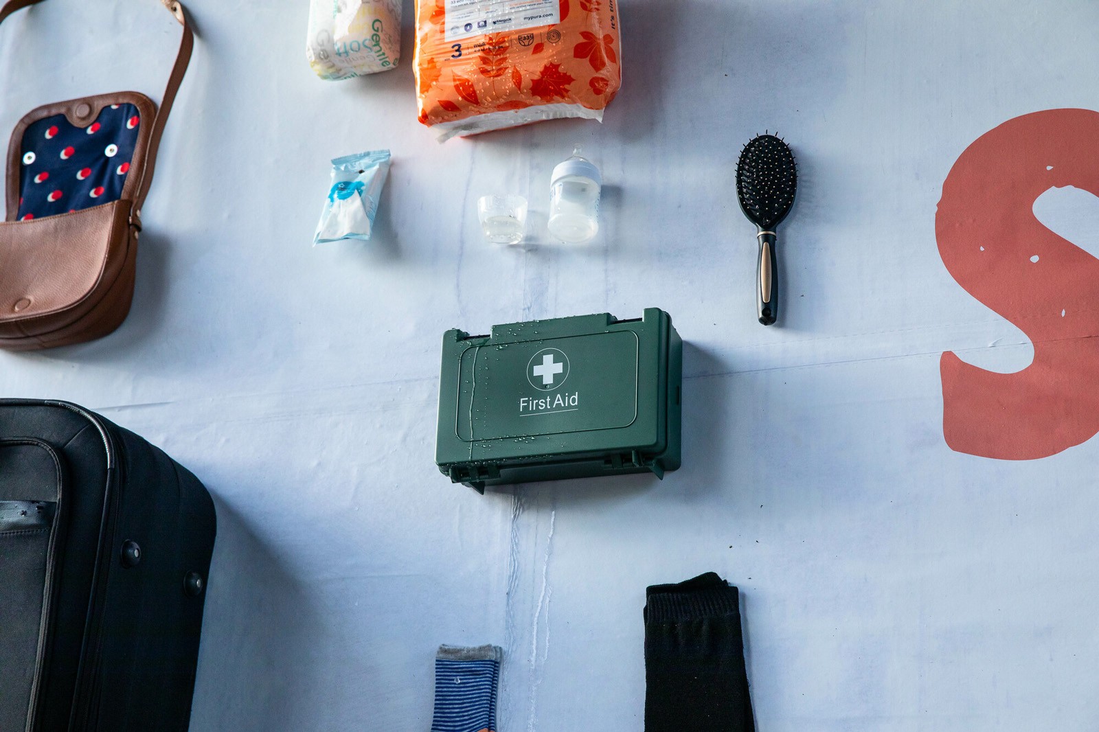 Close up of a first aid kit stuck to a billboard