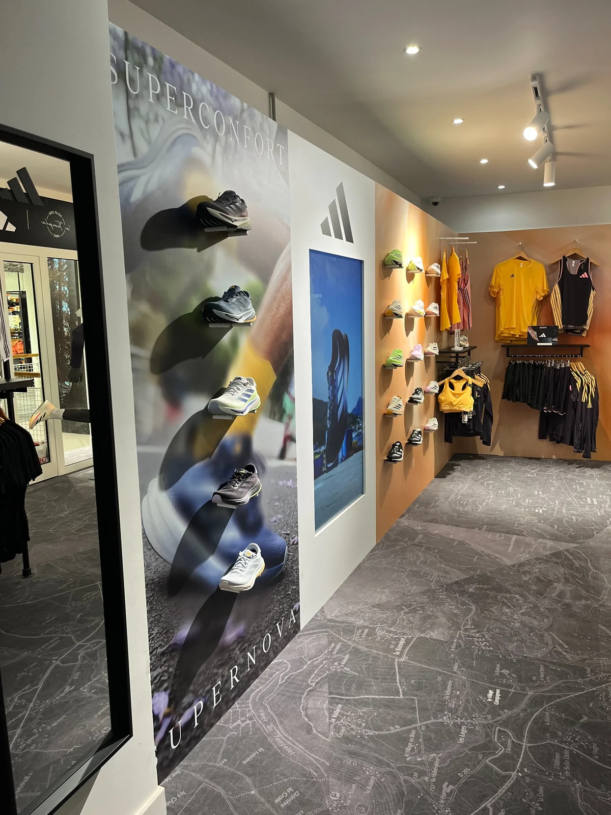 View of the Adidas Terrex pop-up store at Tonton Outdoor - display wall and apparel