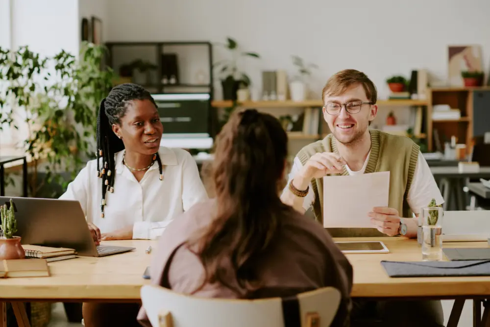 Behavioral health clinic team discussing hiring strategies amid staffing crisis.