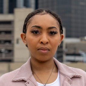 Possible member looking at the camera.