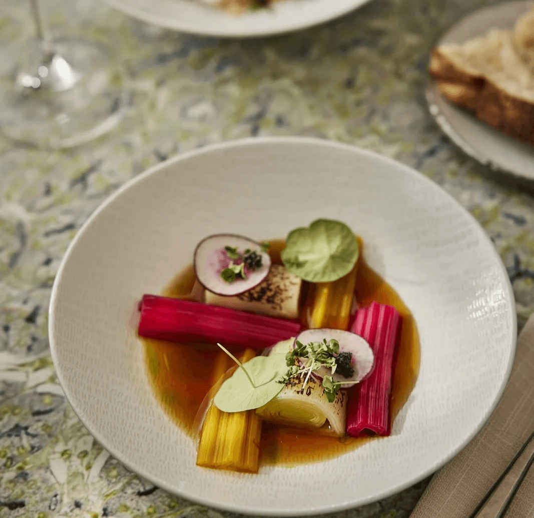 Seasonal vegetable dish with colourful chard, leek and fresh herbs served at Capital Kitchen, Amsterdam’s creative business restaurant.