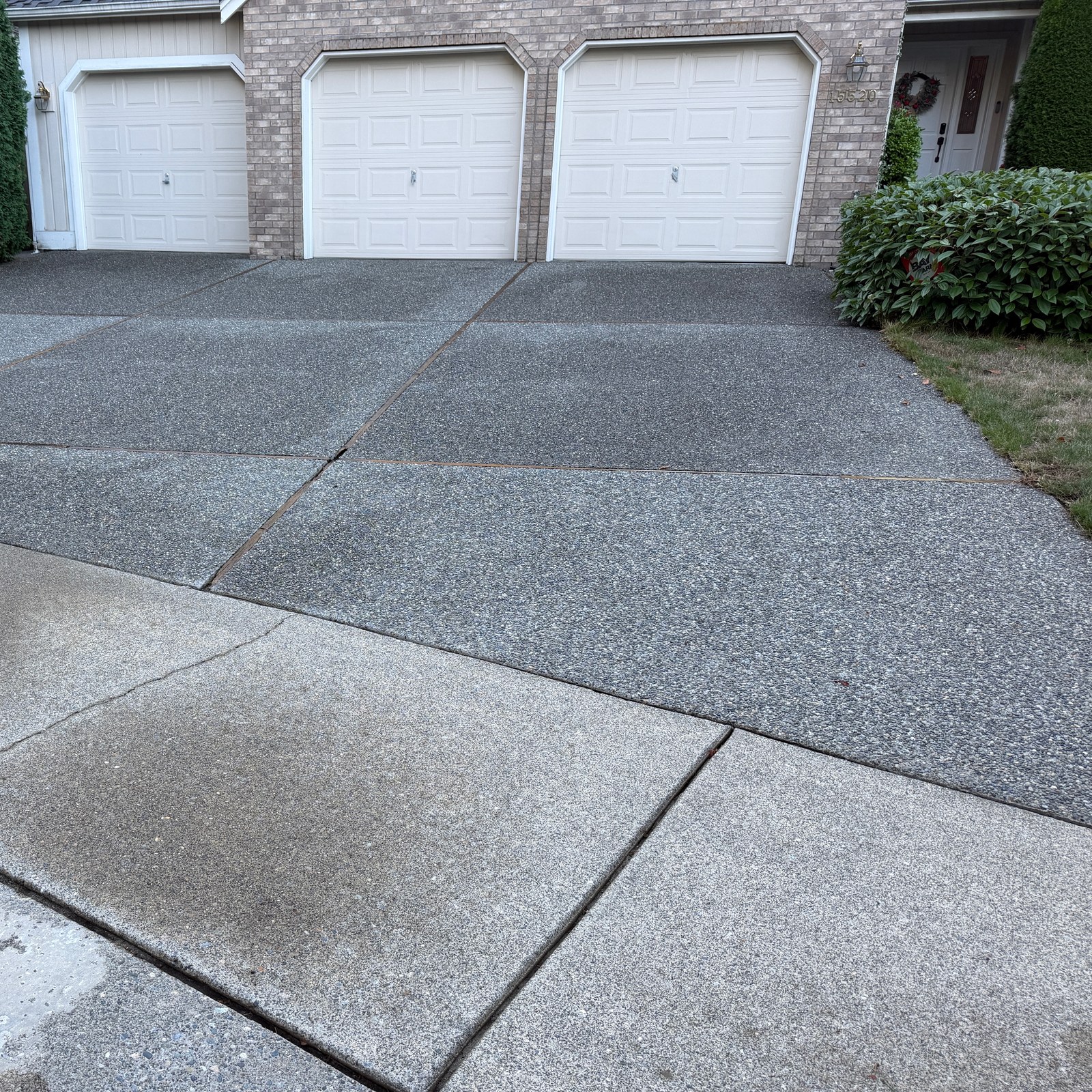After: exposed aggregate driveway pressure washing by Peterson Property Services in Mill Creek, WA
