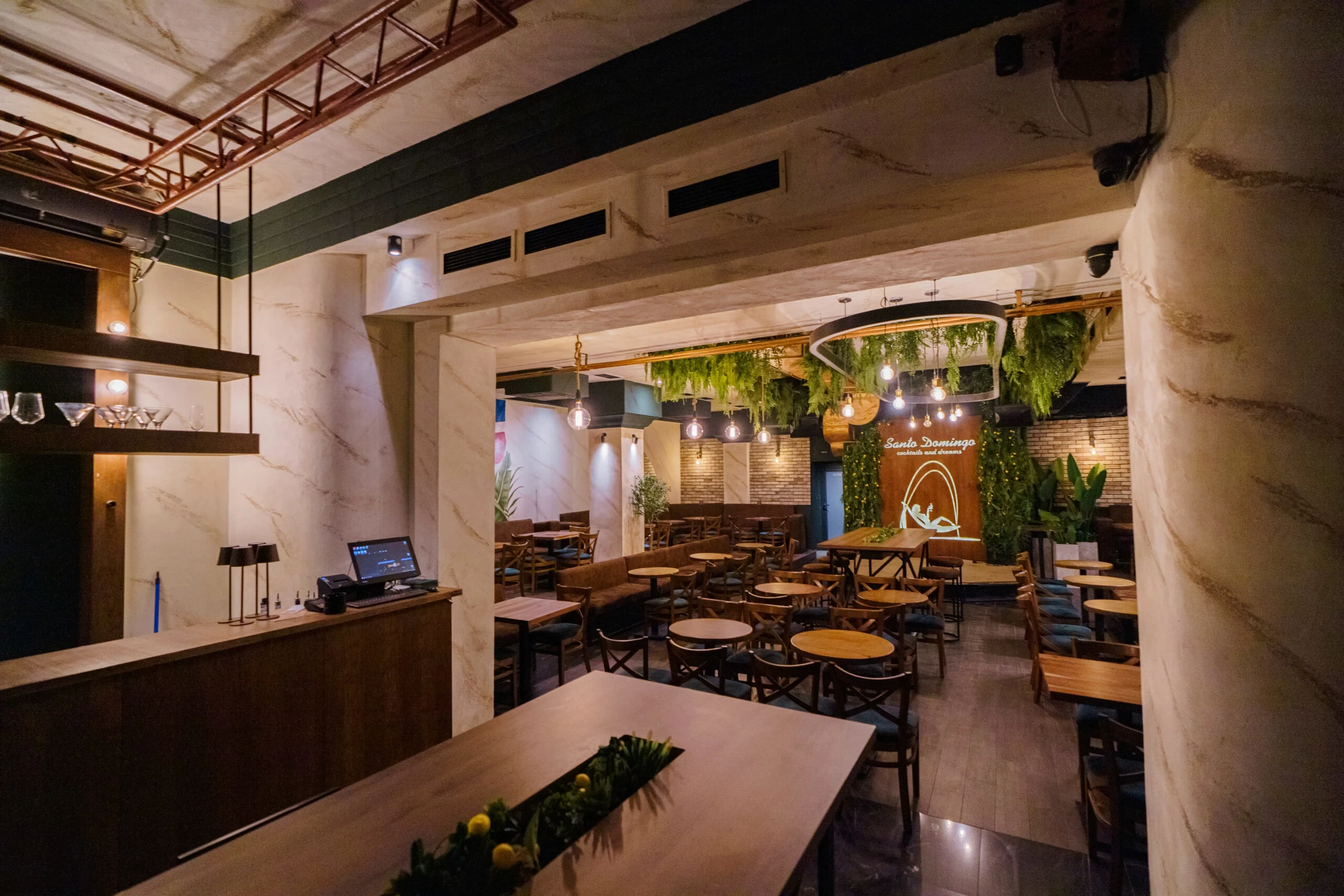 Santo Domingo is a stylish lounge bar and restaurant in central Belgrade, known for its warm interior, garden atmosphere, international cuisine, cocktails, and live music nights