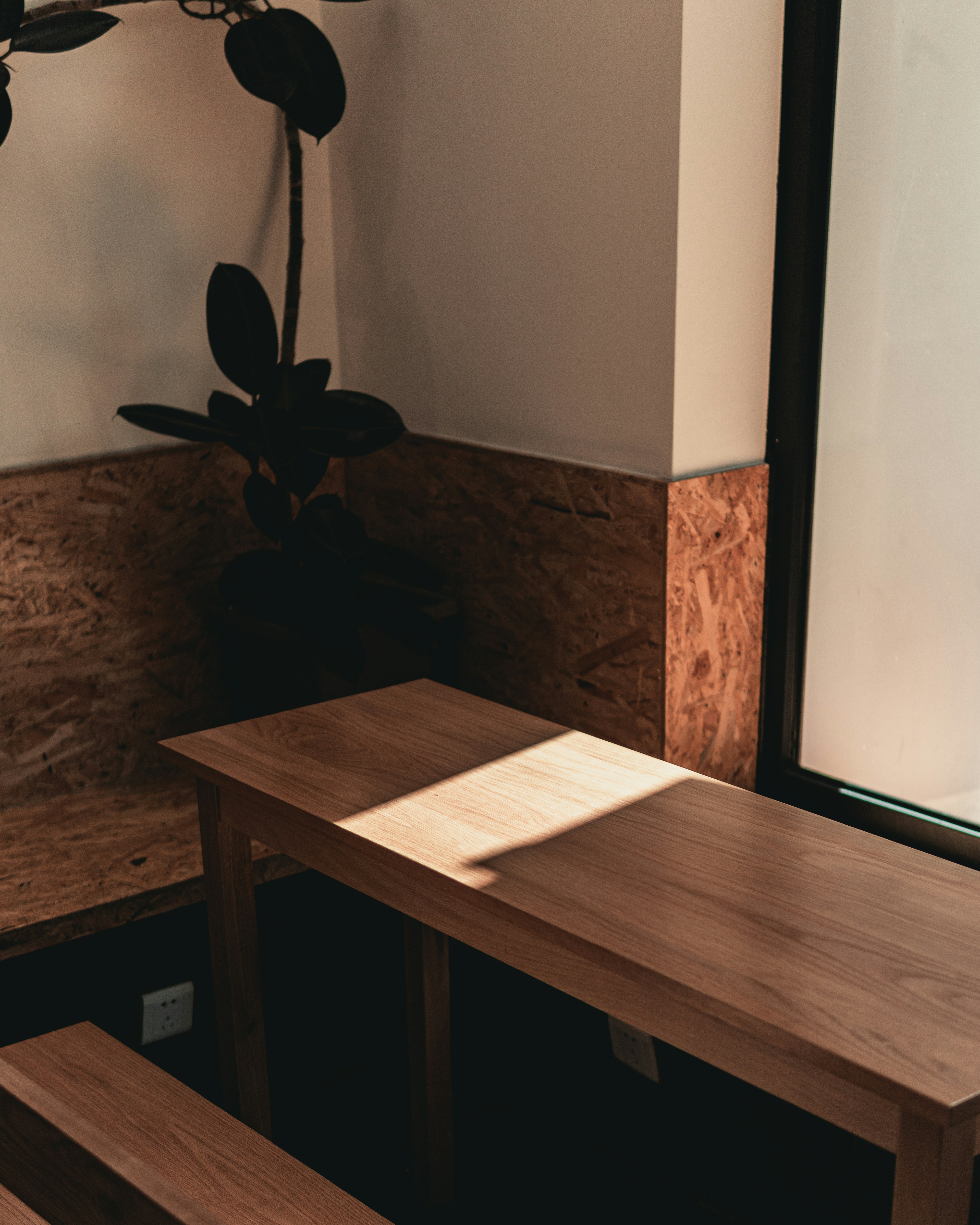 brown wooden table near brown wooden door