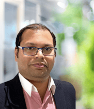 A photograph of Amit, the head of operations (UK) for Heimstaden. 