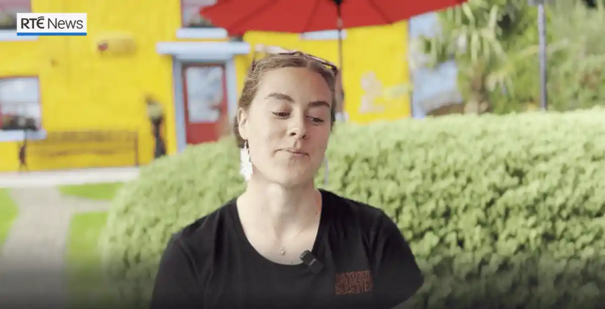 Manager of the Strawberryfield sitting infront of the restaurant