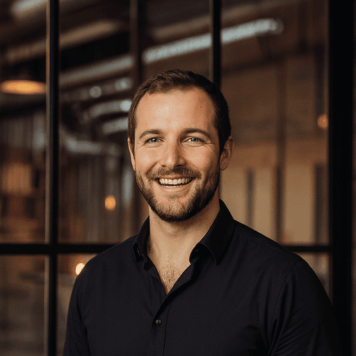 kevin mccormick in a black business shirt with a glass panel background at experieco