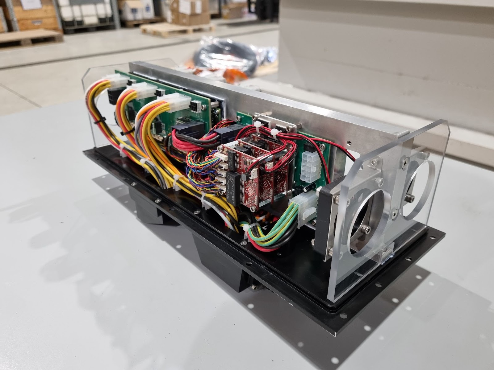 Opened Proteus electronics module with BotBlox boards integrated among the wiring