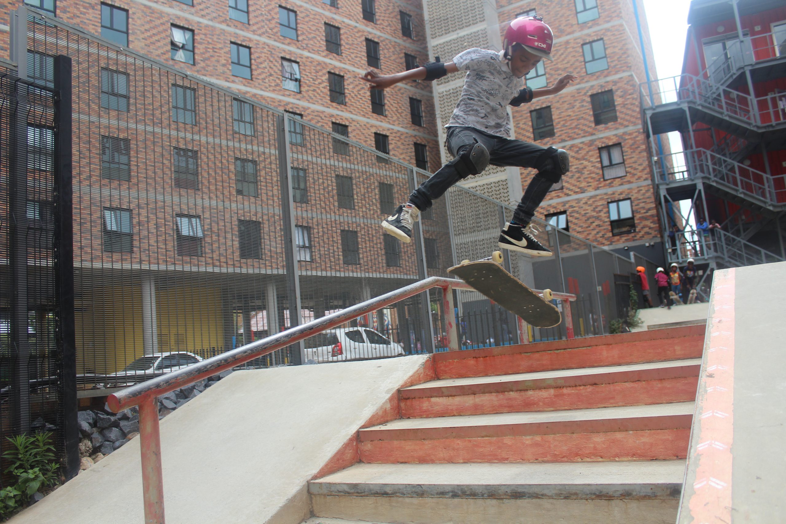 Kid jumping in the air with skateboard