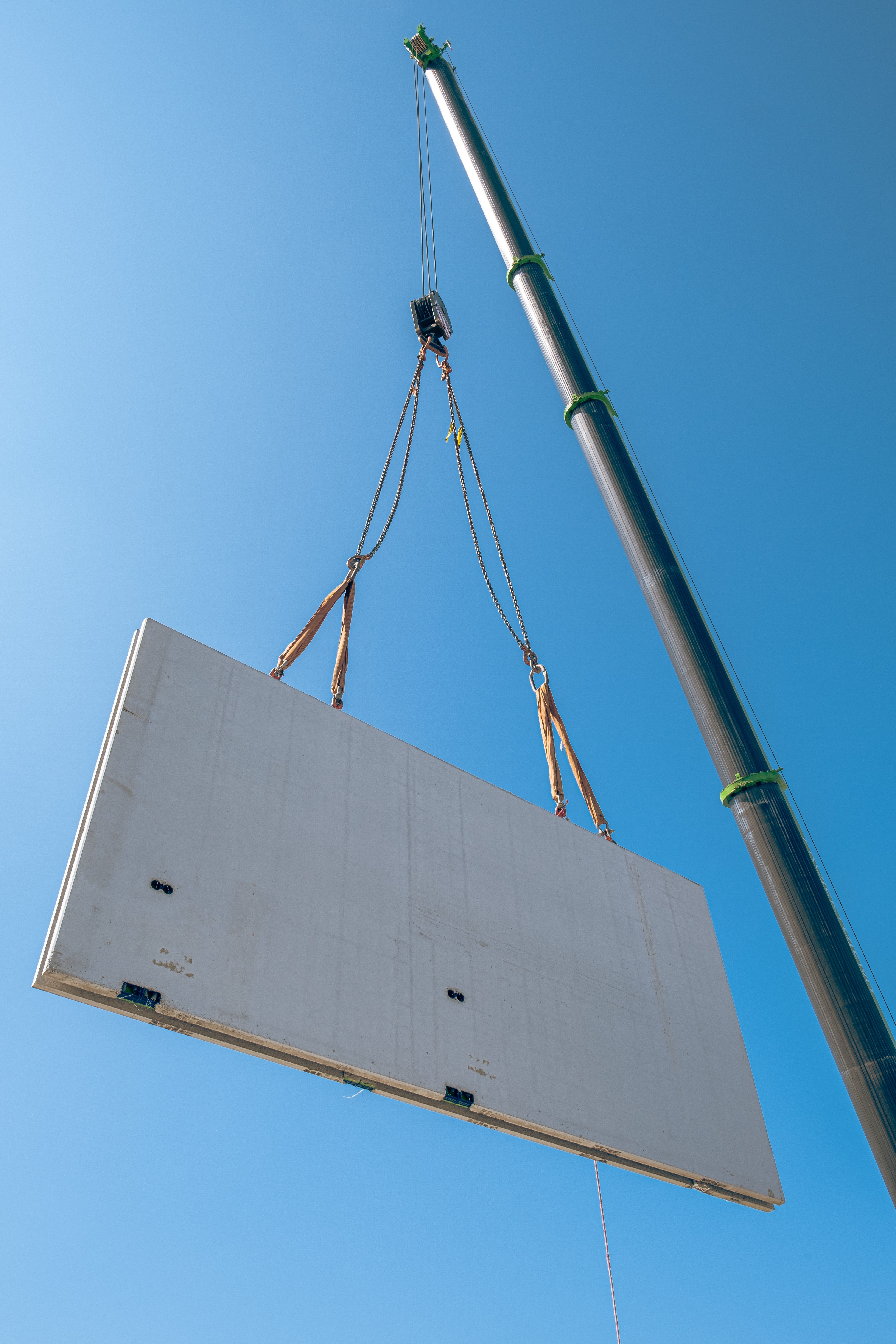 Colleagues collaborate while examining computer designs.
