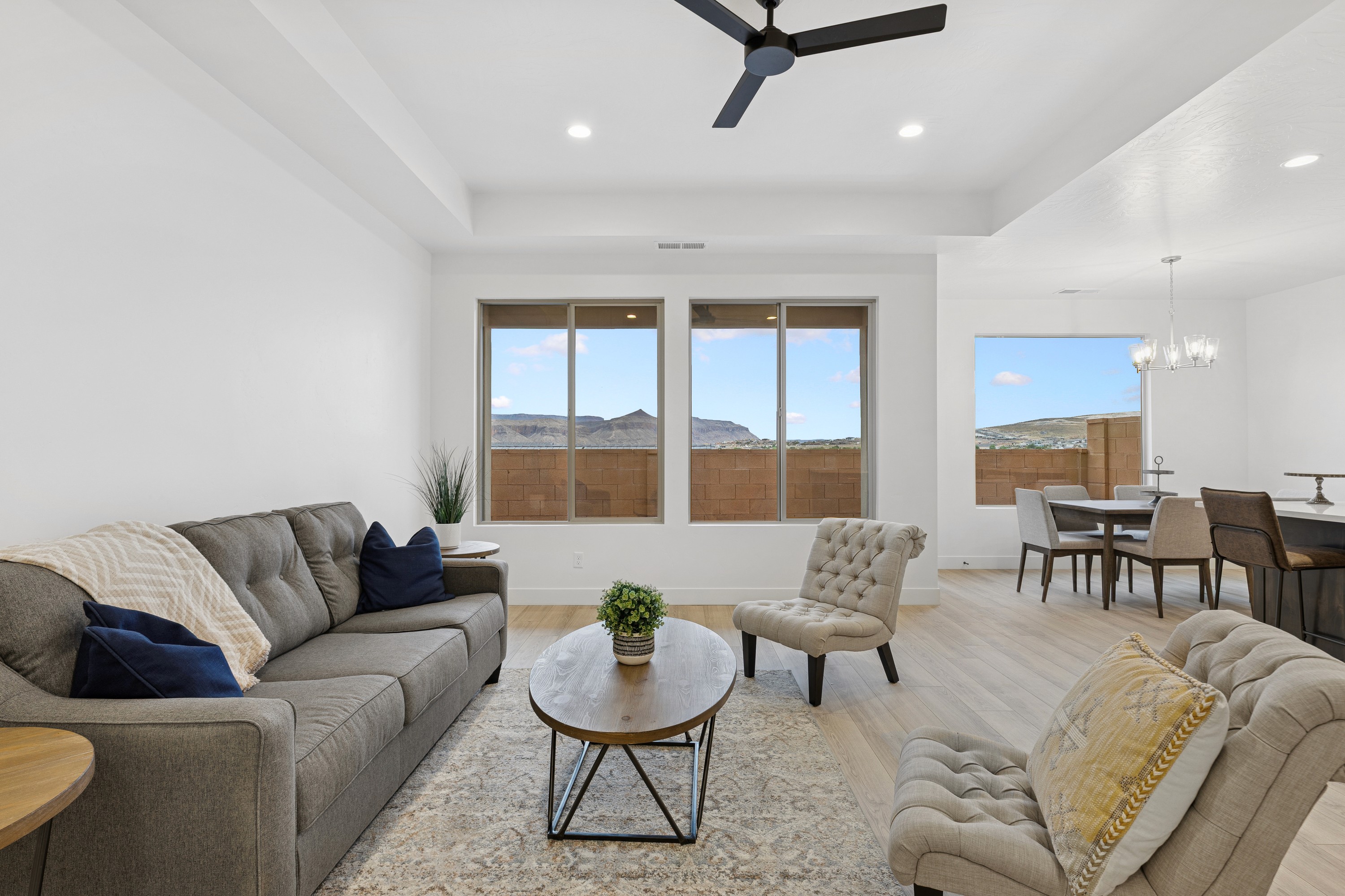 Bright living area in The High Desert Home with seating and modern finishes in Hurricane Utah.