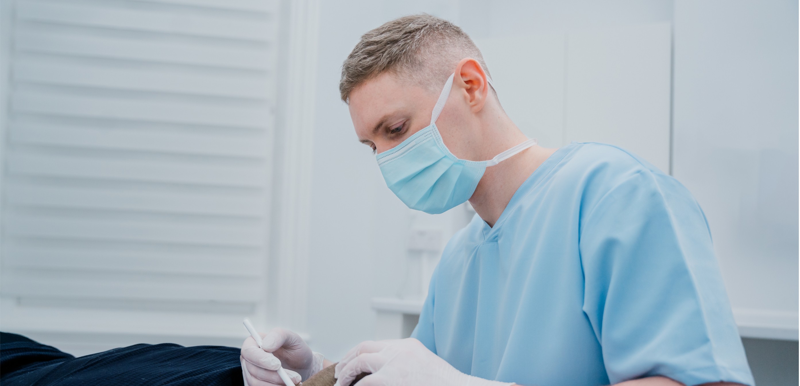 Dr Clarke Performing Hair Transplant Surgery