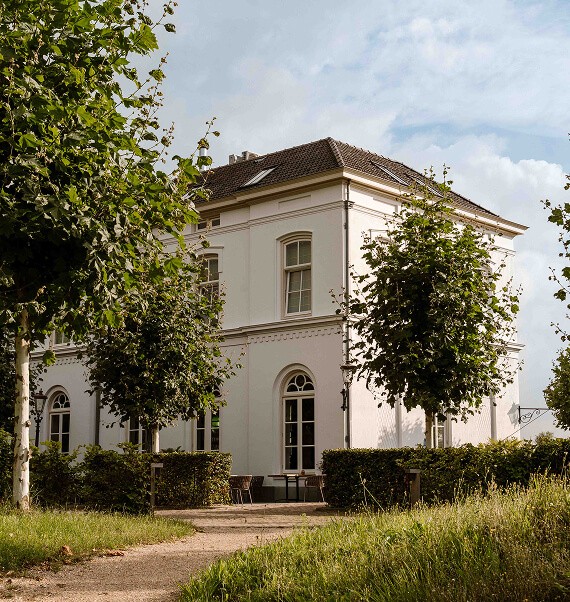 Sage green walls bedroom with lilac duvet and modern style