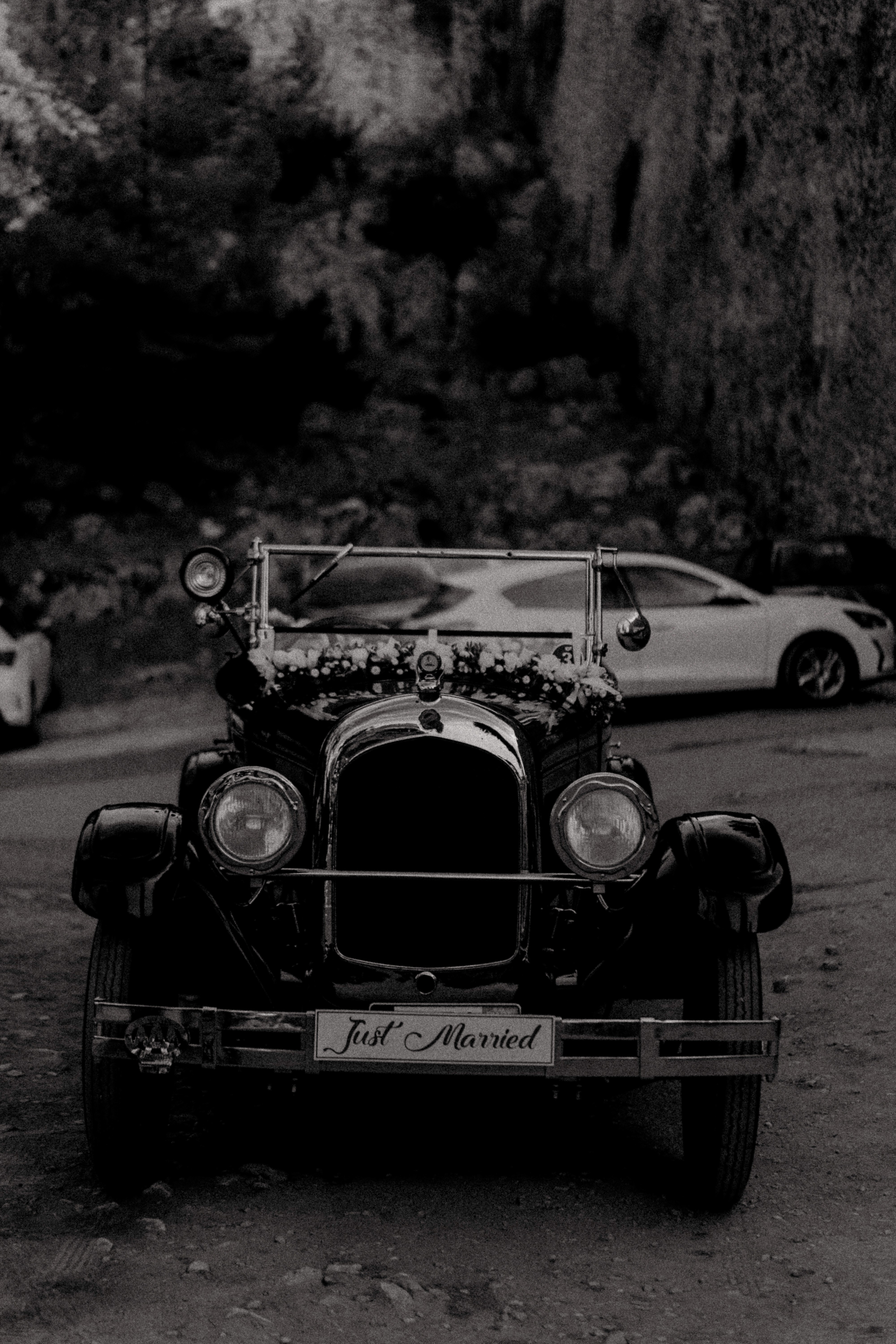 Classic vintage wedding car decorated with custom floral arrangements for a destination wedding in Messinia