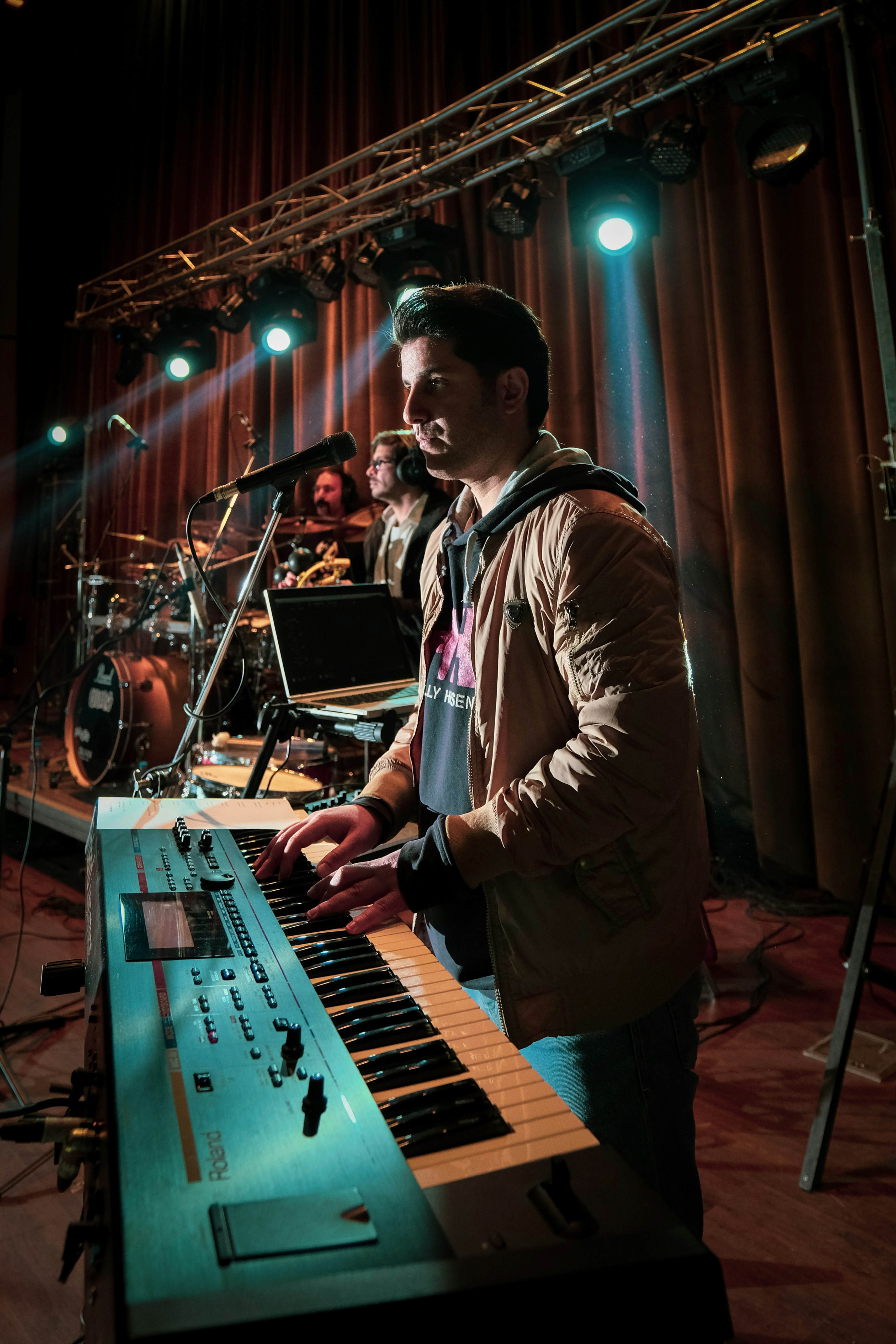 guy playing piano and singing