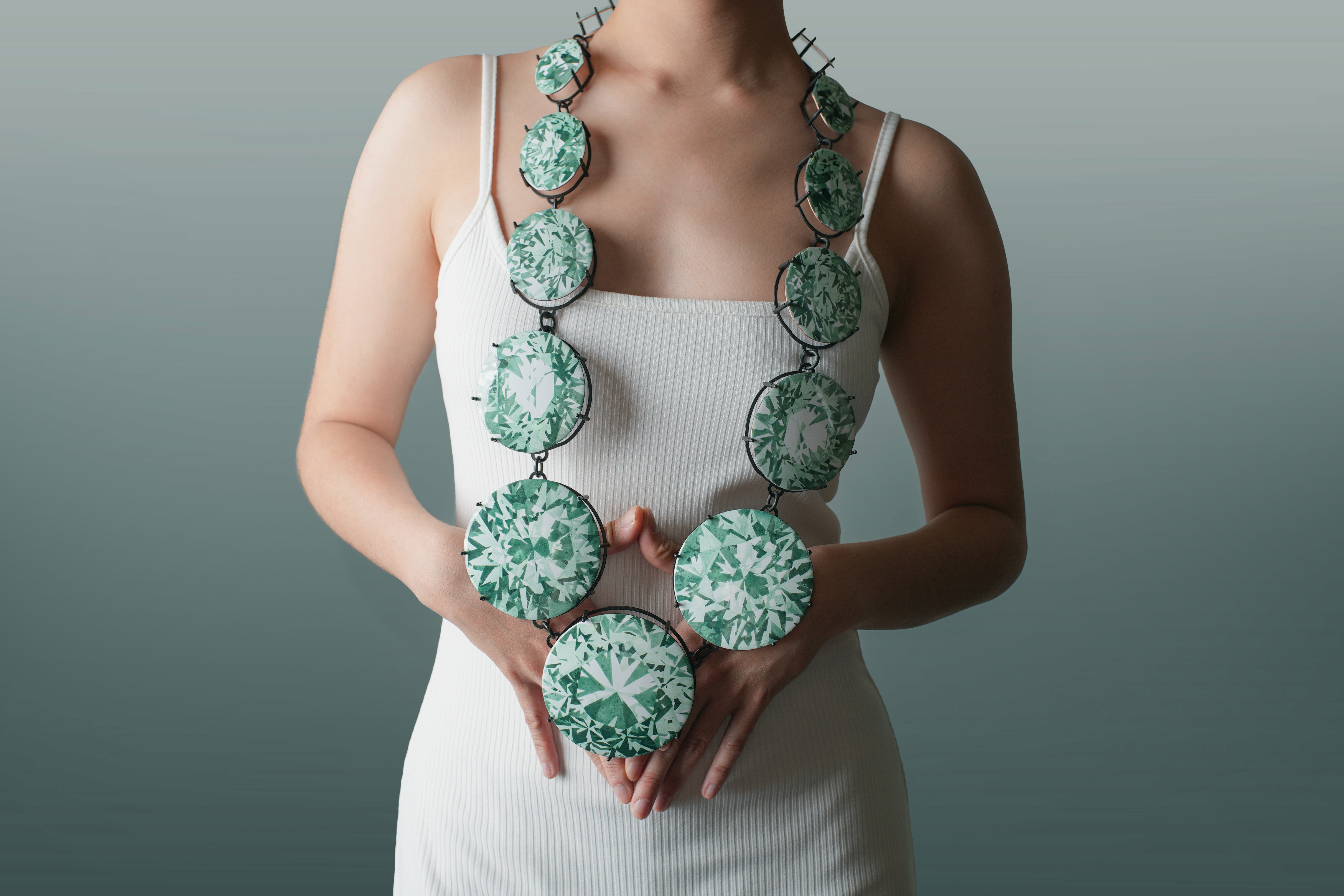 Gem by Yuxin Song worn by a model, painted enamel on copper, contemporary jewelry necklace, selected for SCHMUCK 2026 Munich