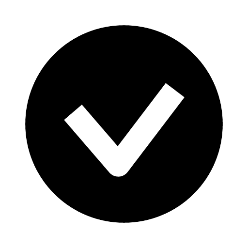 A young woman with long hair smiles while standing against a green backdrop, wearing a casual dark sweater.