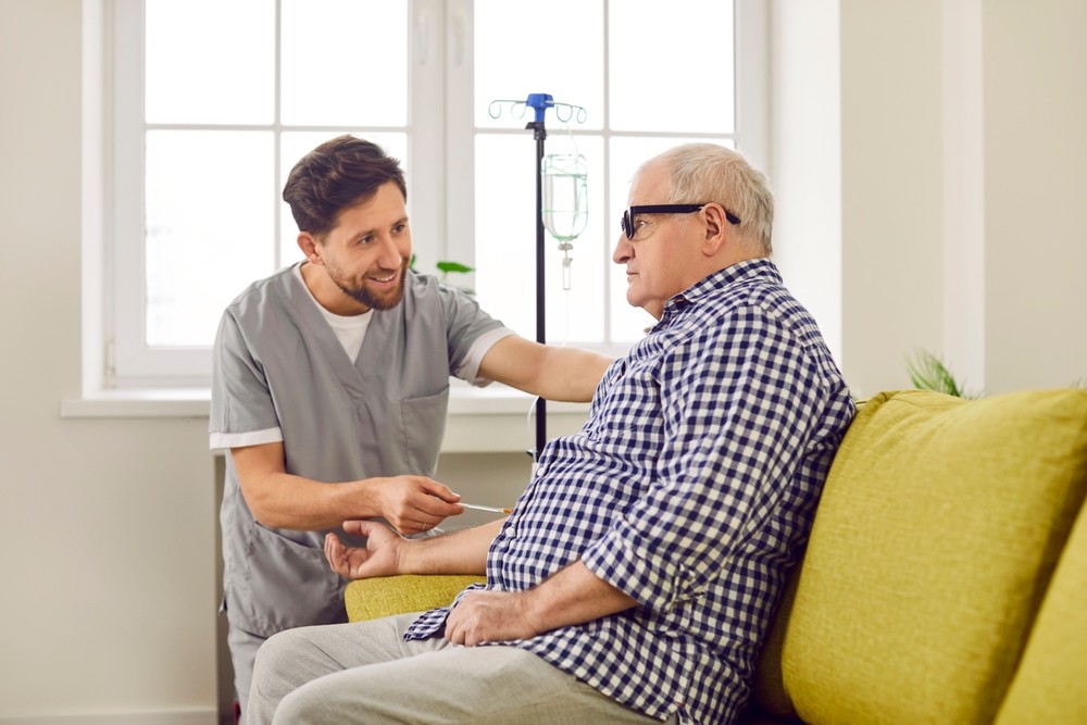 young friendly smiling nurse man helping