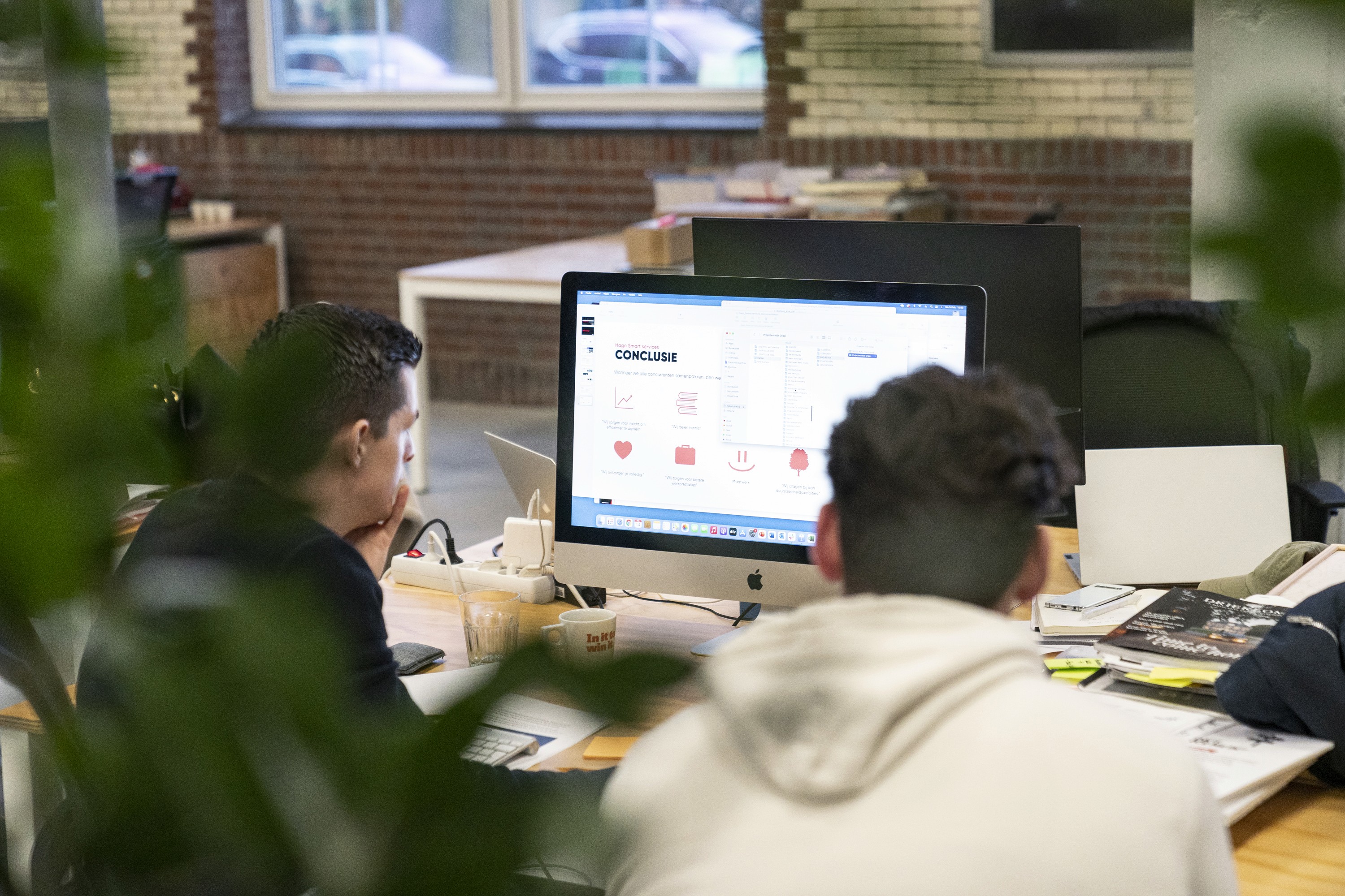 two people looking at a screen