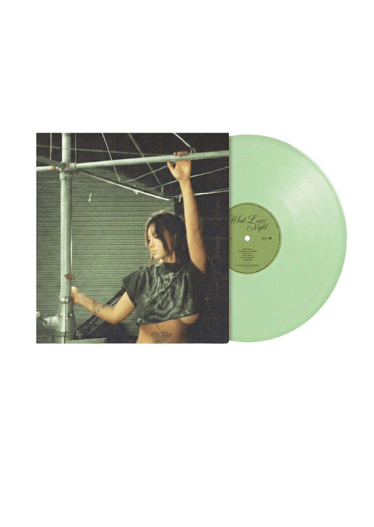 Female artist holding Blaze Vinyl record with green disc visible