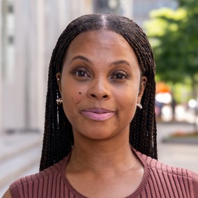 Possible member smiling and looking at the camera.