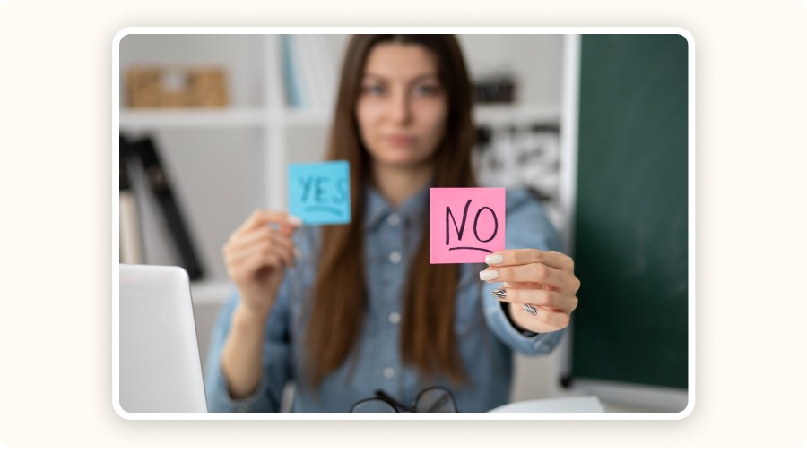 Woman holding “YES/NO” notes