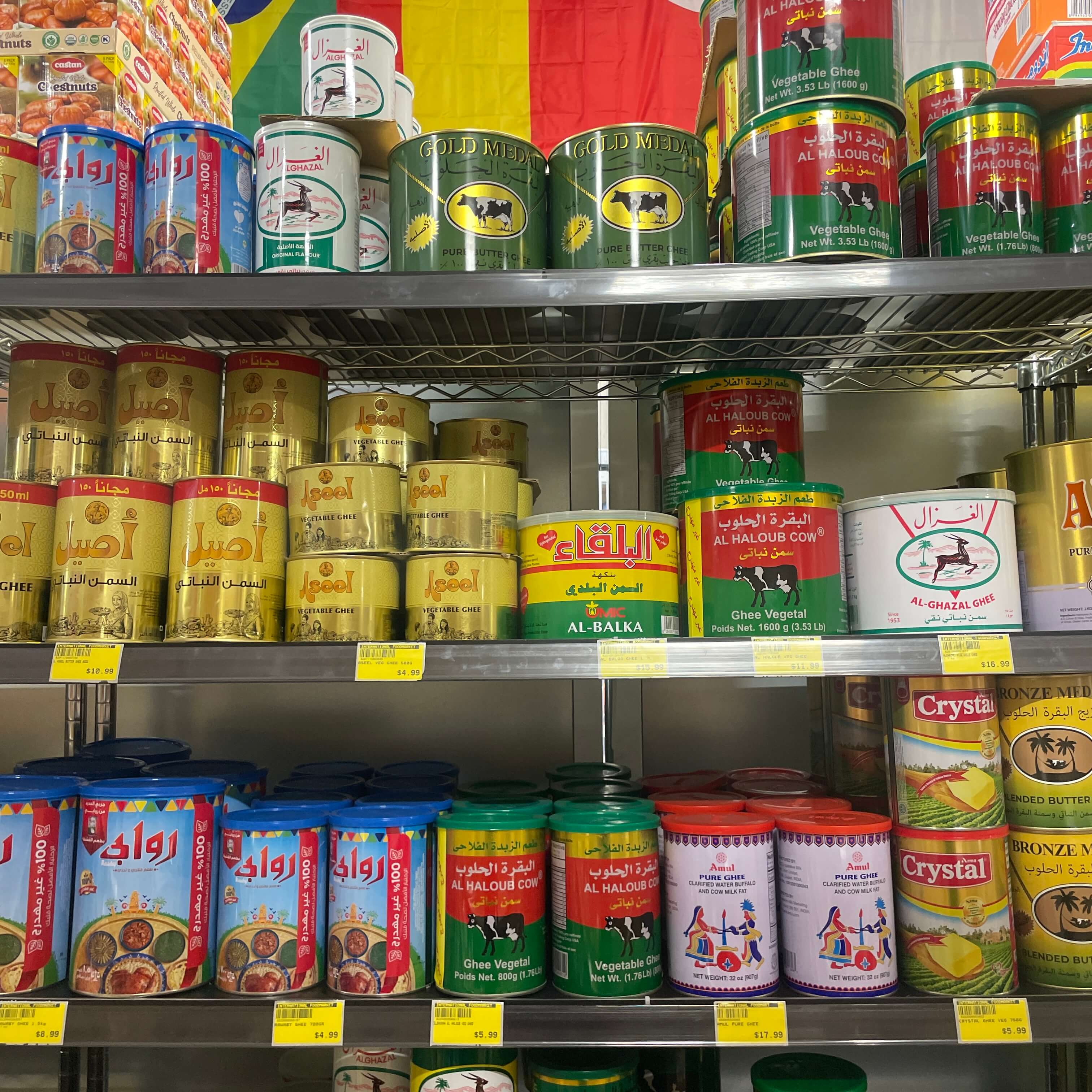 Large tins of ghee and cooking fats at International Food Market Orlando.