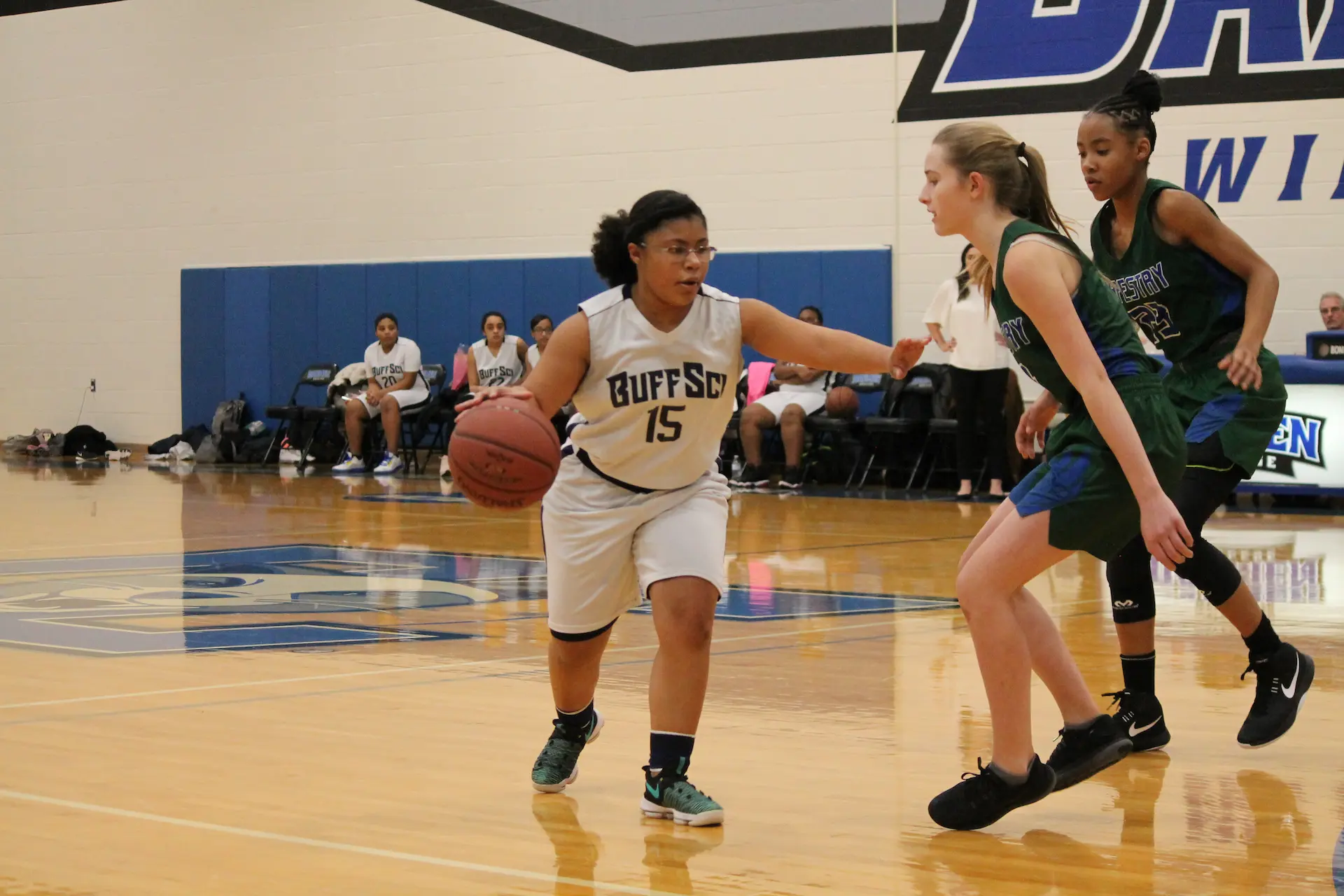 BuffSci high school students playing basketball during athletics program