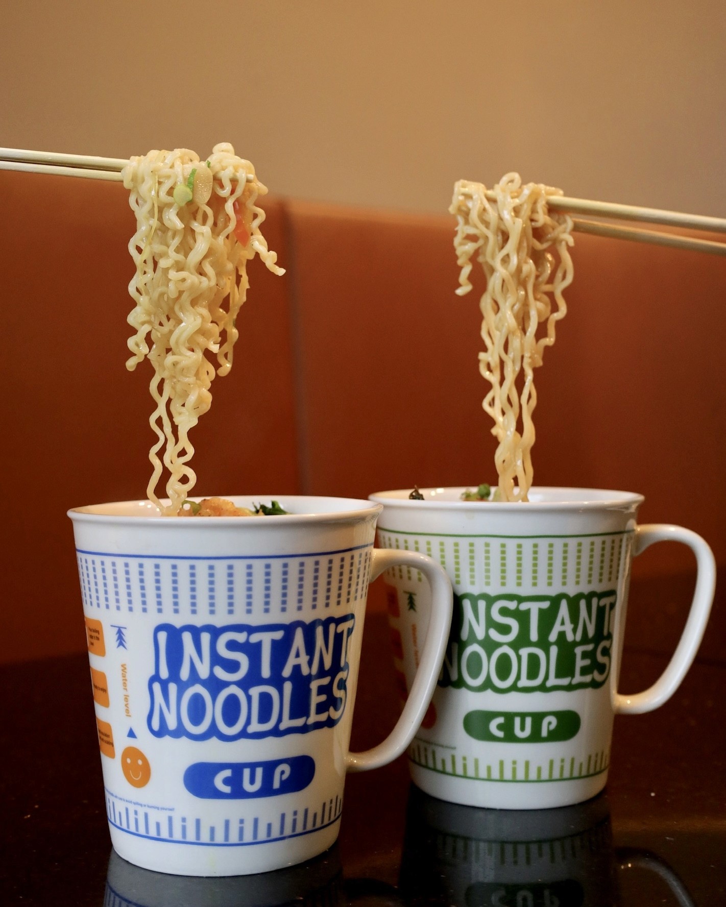 A gourmet take on classic instant ramen, Cup Nomiya features rich broth, premium toppings, and fresh noodles, served in a ceramic ramen cup for a nostalgic yet elevated dining experience.