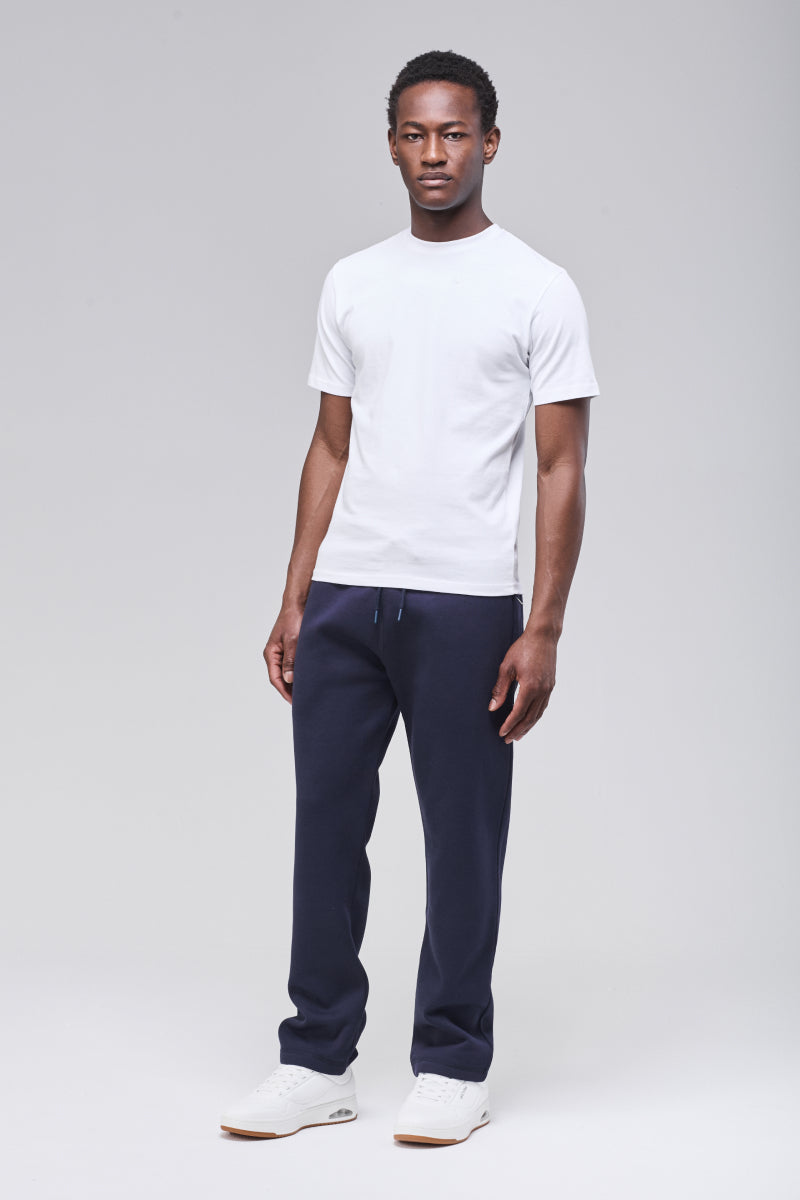 Male model wearing navy Langley sweatpants, full figure