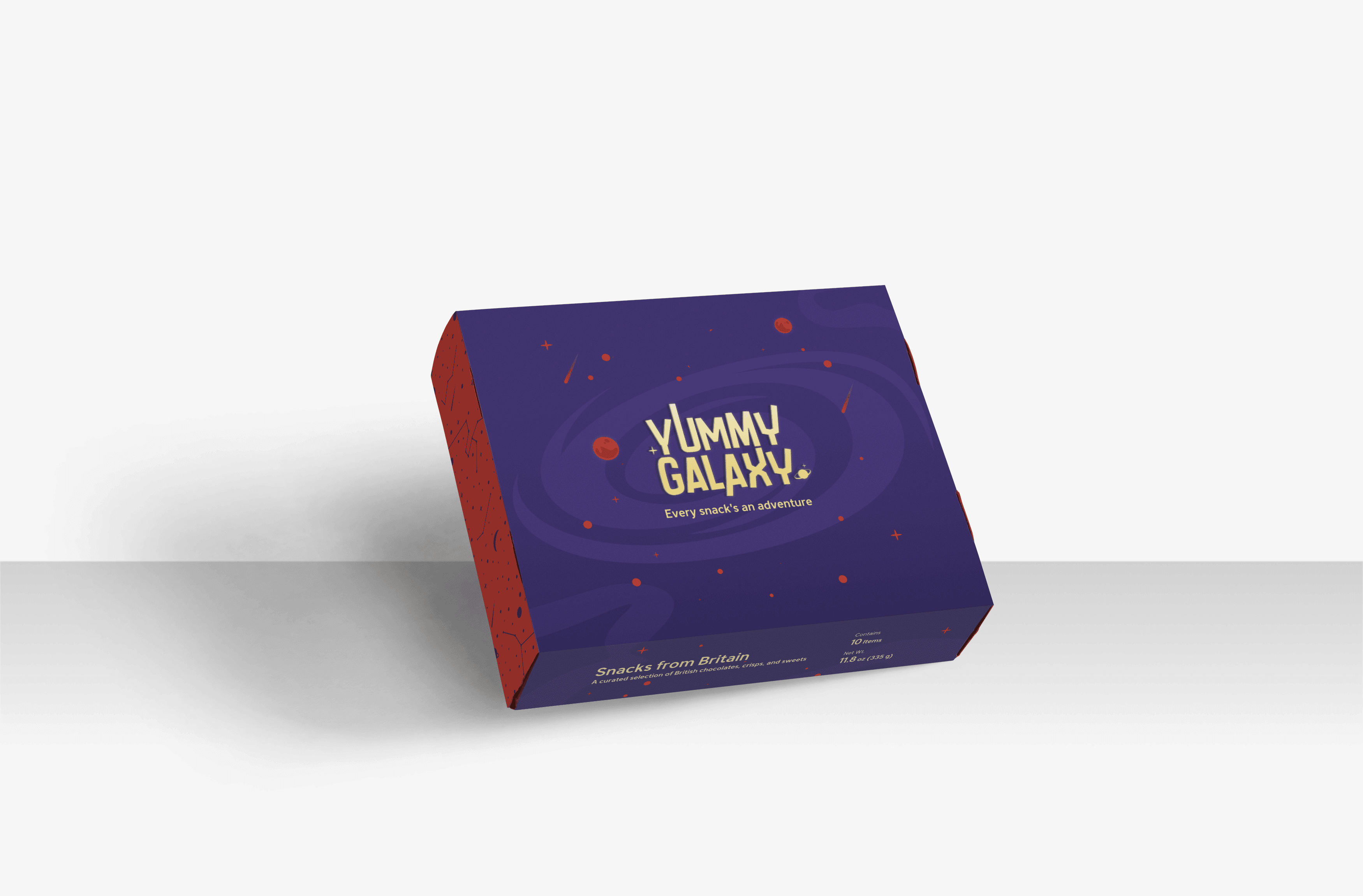 A purple and red box titled "Yummy Galaxy" with a cosmic design, featuring planets and stars. The box promises an adventurous snack experience.