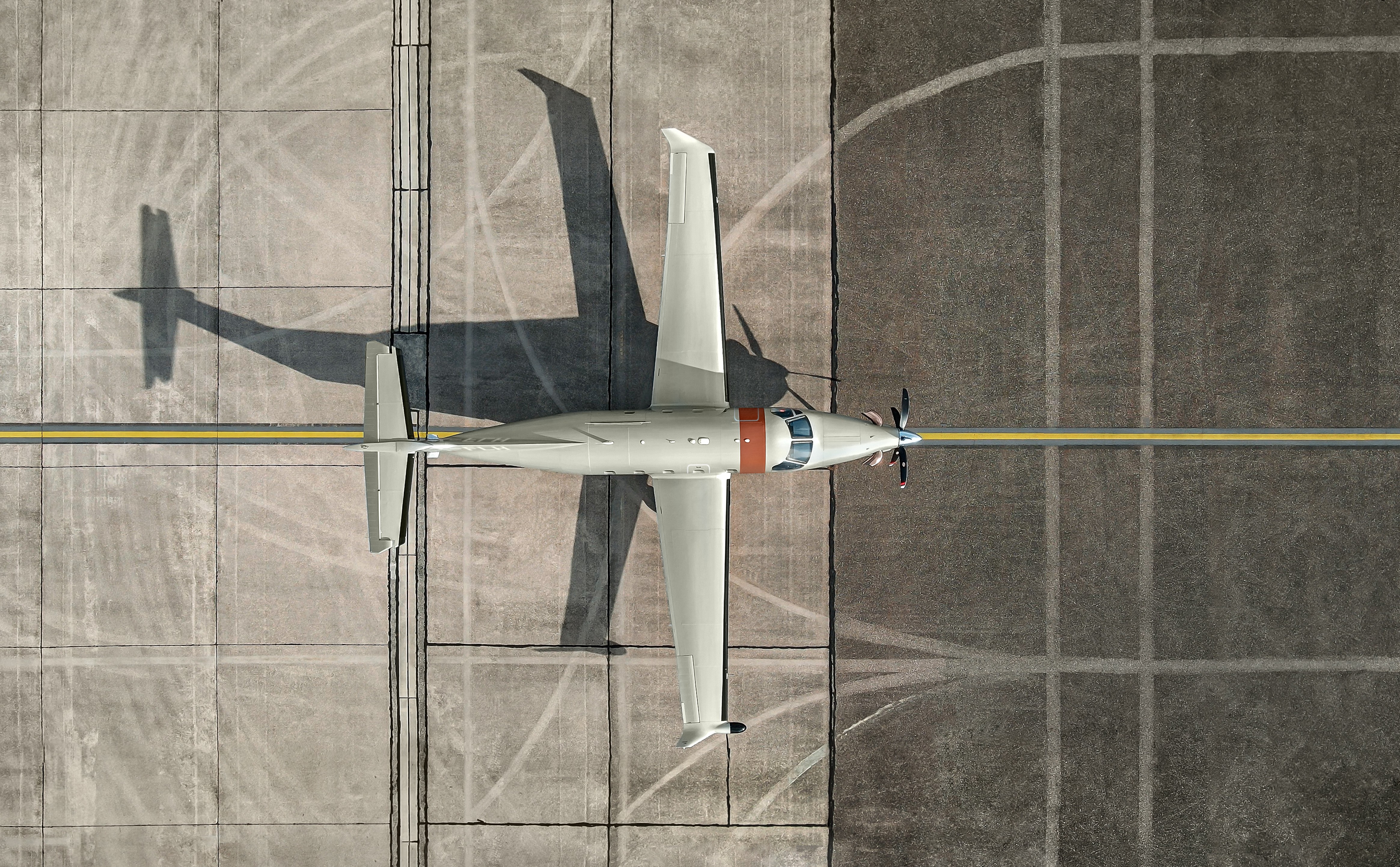 Jetfly Pilatus PC-12 on a runway from top.