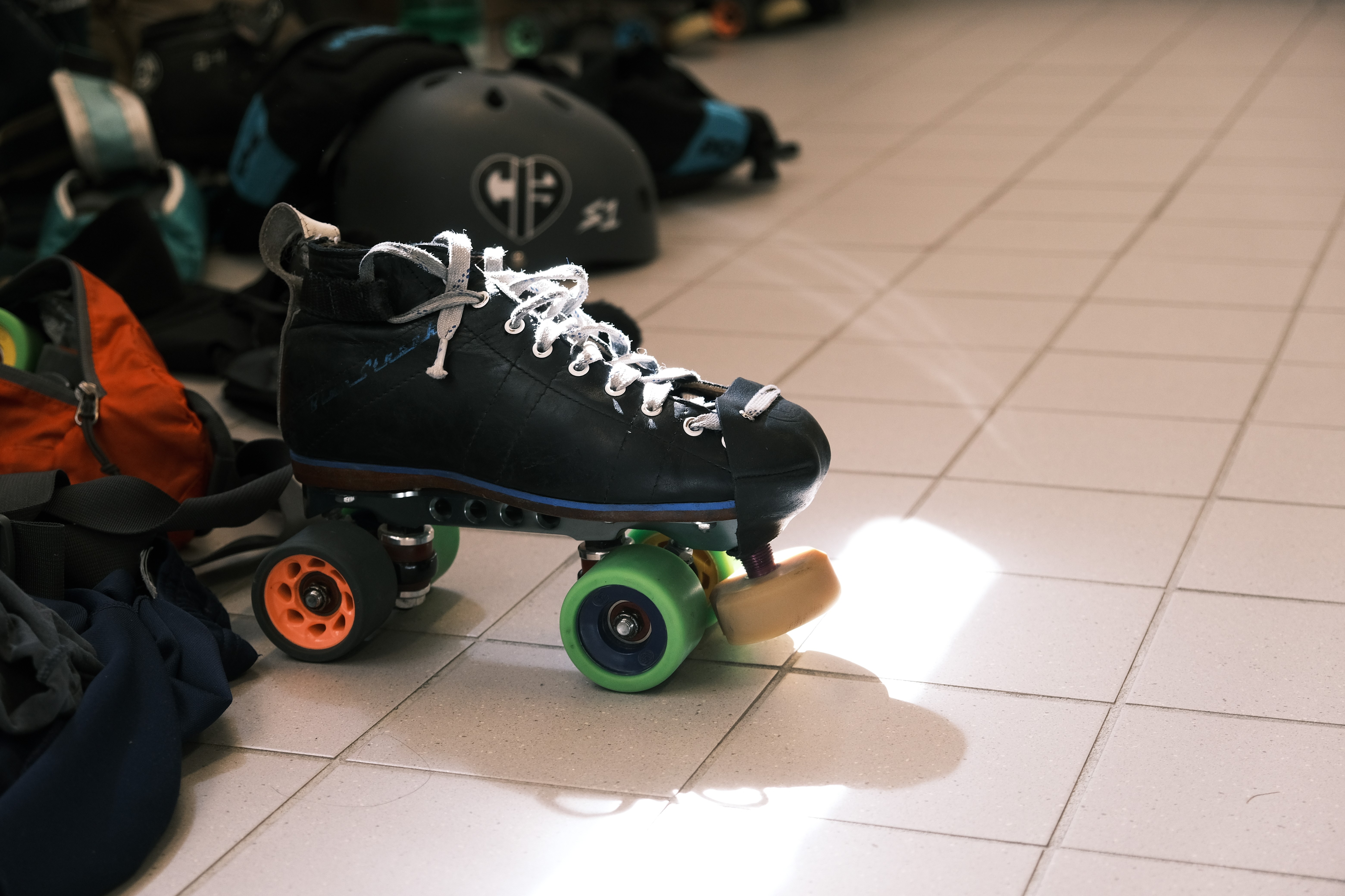 A single roller derby skate in a changing room.