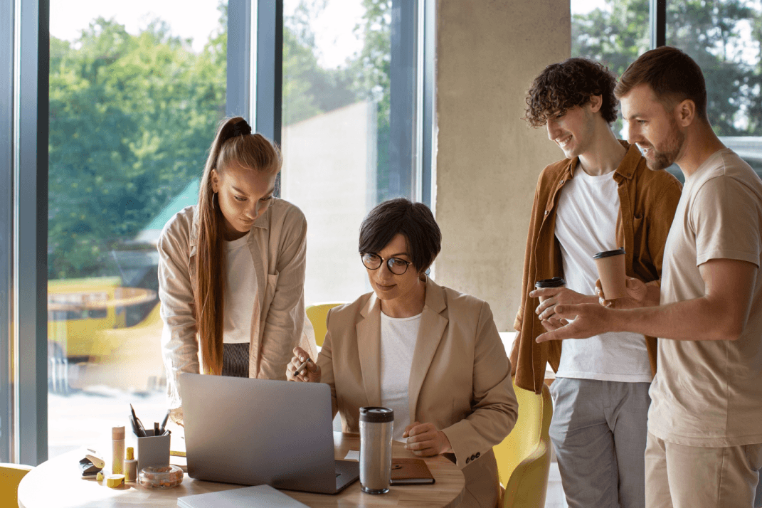 Group of people using laptop