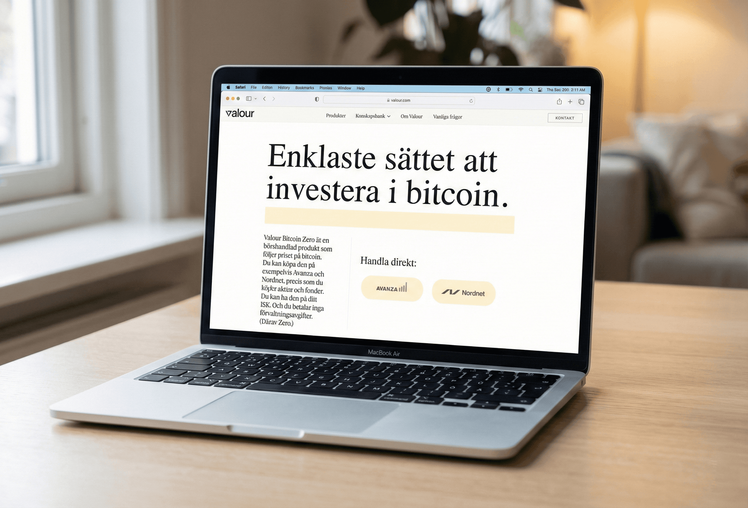 Newspaper and a laptop on a table