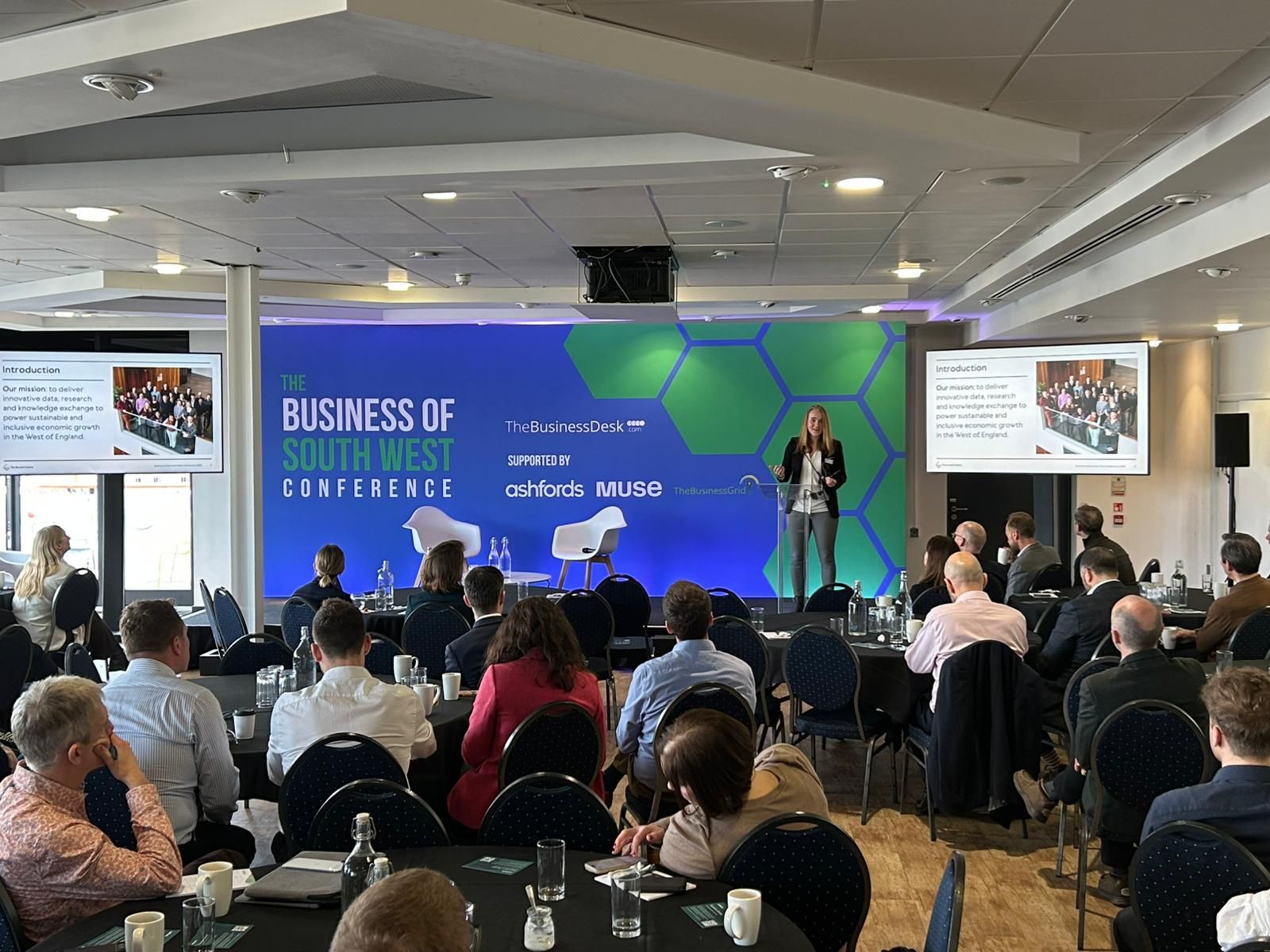 Lucy Martin on stage presenting at Brunel Centre Showcases Evidence‑Led Growth Vision at Business of the South West Conference