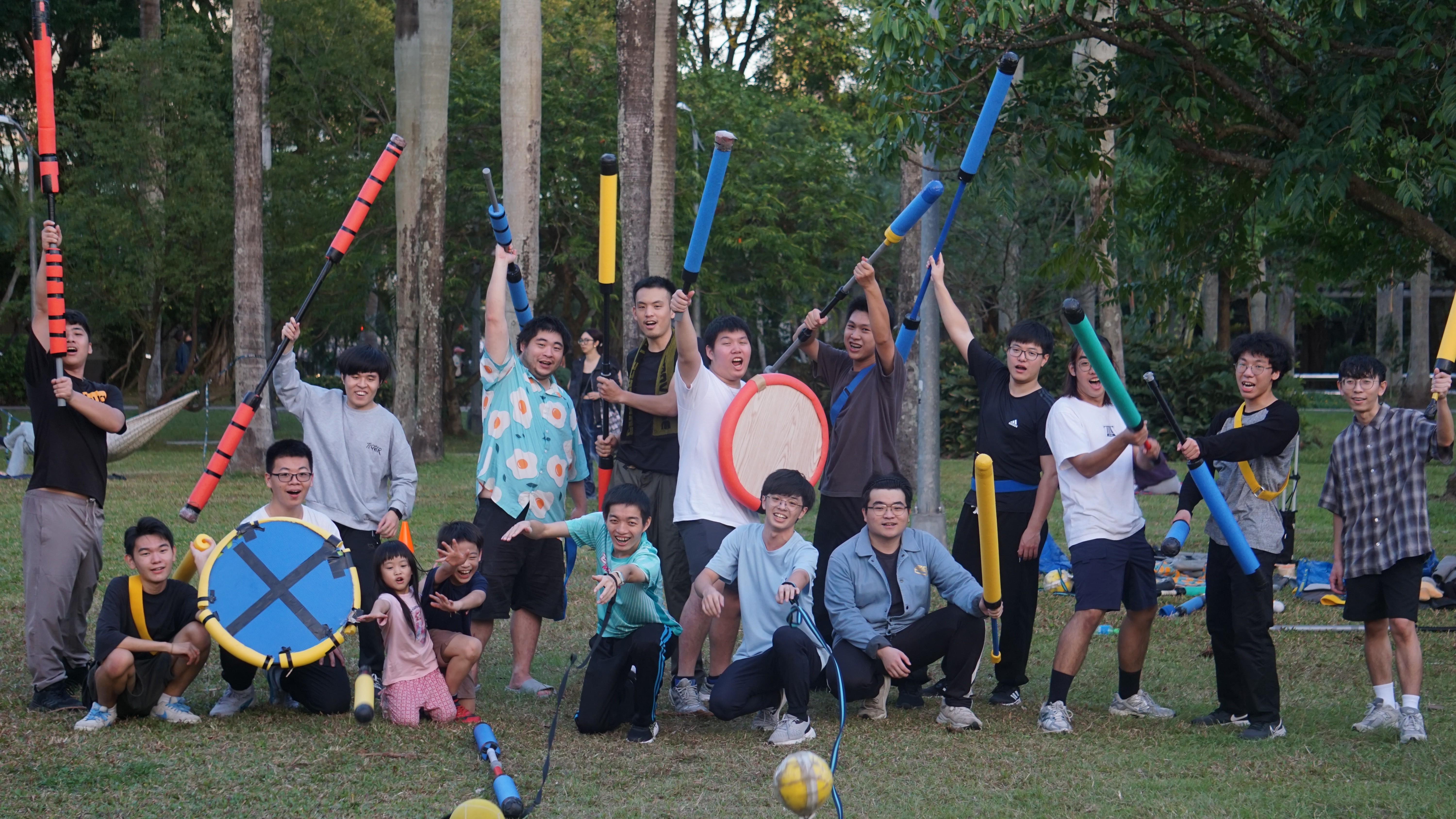 kids lying on a glass land and smiling
